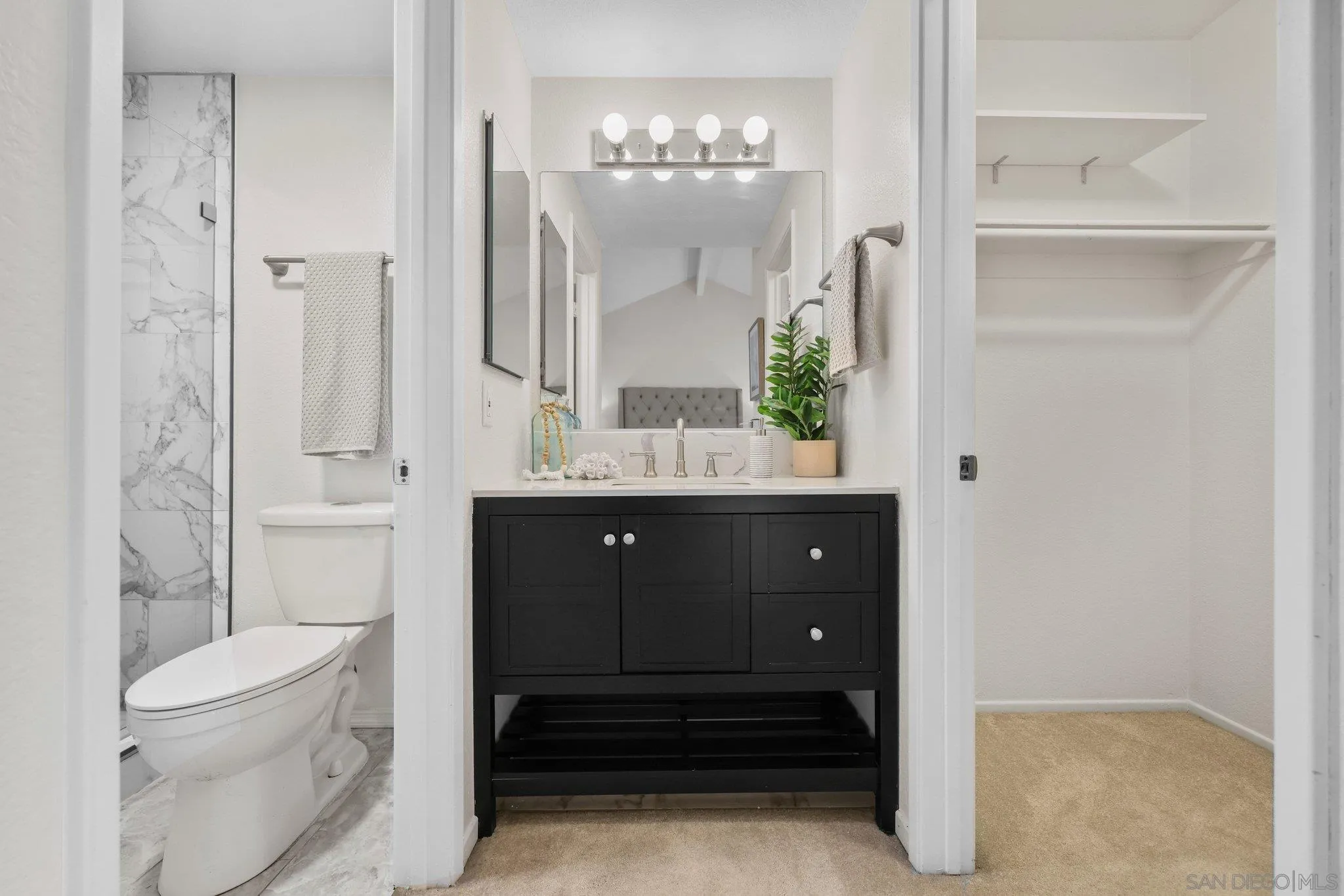 740 Breeze Hill Road, Unit 193 Vista, CA 92081 - Photo 16 of 35 a bathroom with a sink a toilet and shower