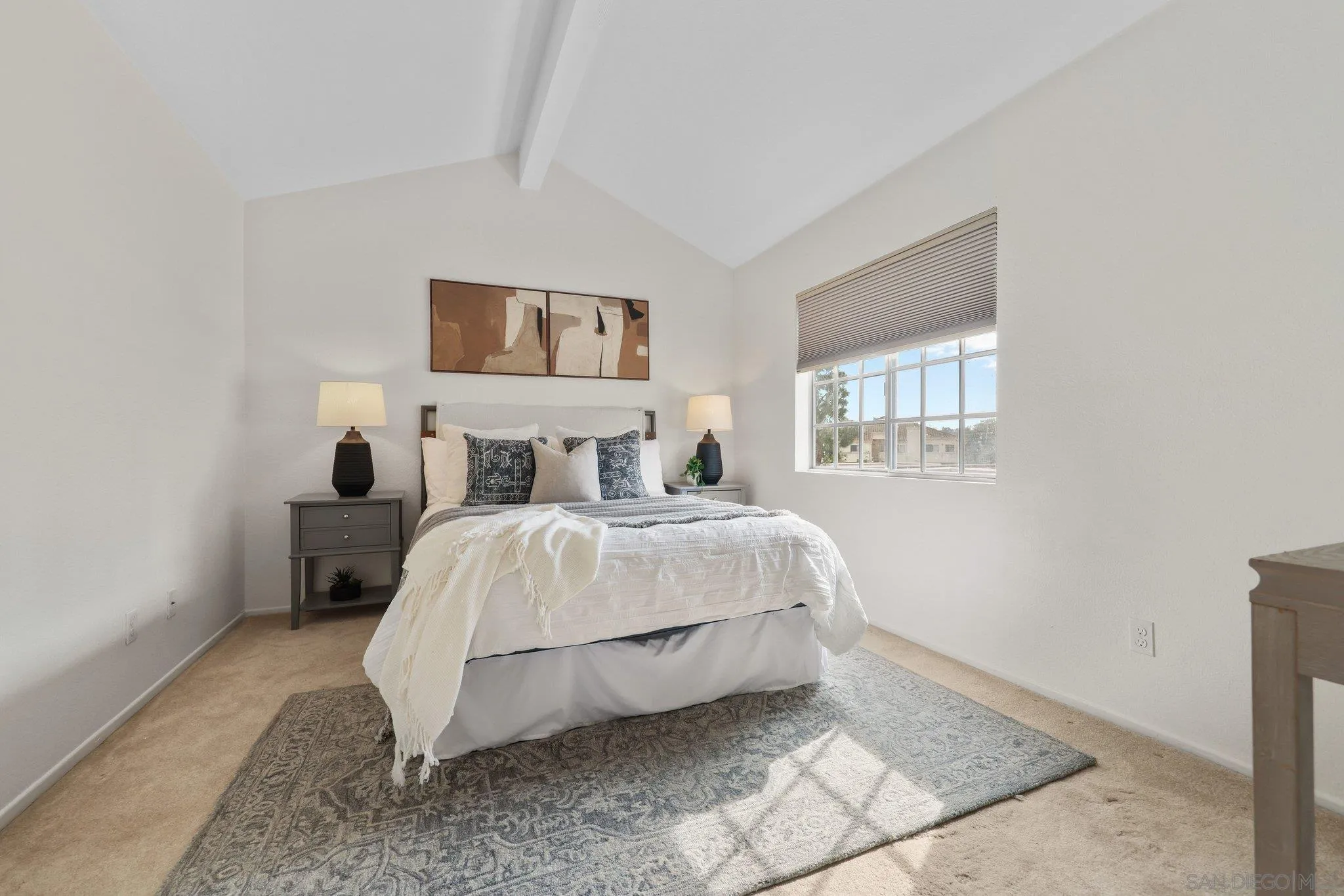 740 Breeze Hill Road, Unit 193 Vista, CA 92081 - Photo 19 of 35 a bedroom with a bed and lamps