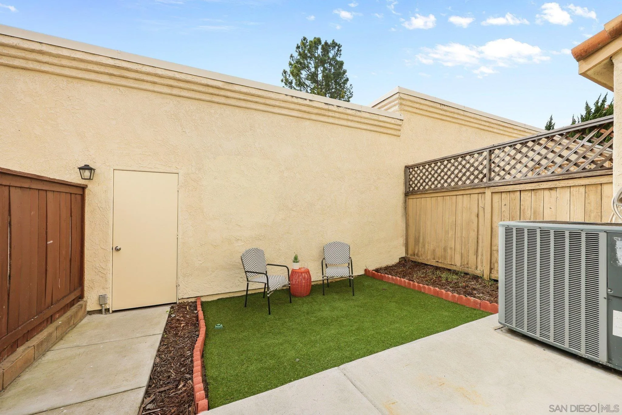 740 Breeze Hill Road, Unit 193 Vista, CA 92081 - Photo 26 of 35 a view of a backyard with wooden fence