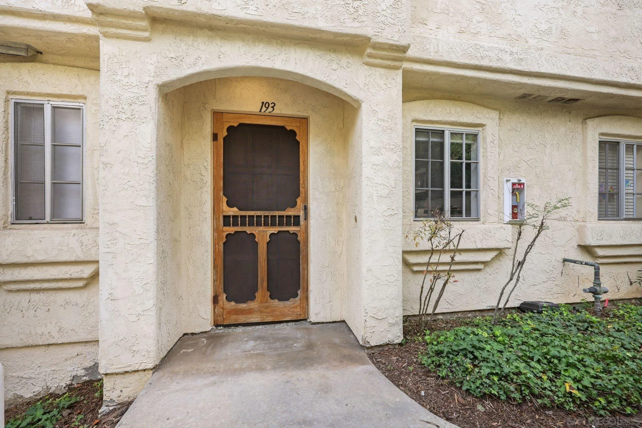 740 Breeze Hill Road, Unit 193 Vista, CA 92081 - Photo 29 of 35 a front view of a house with many windows