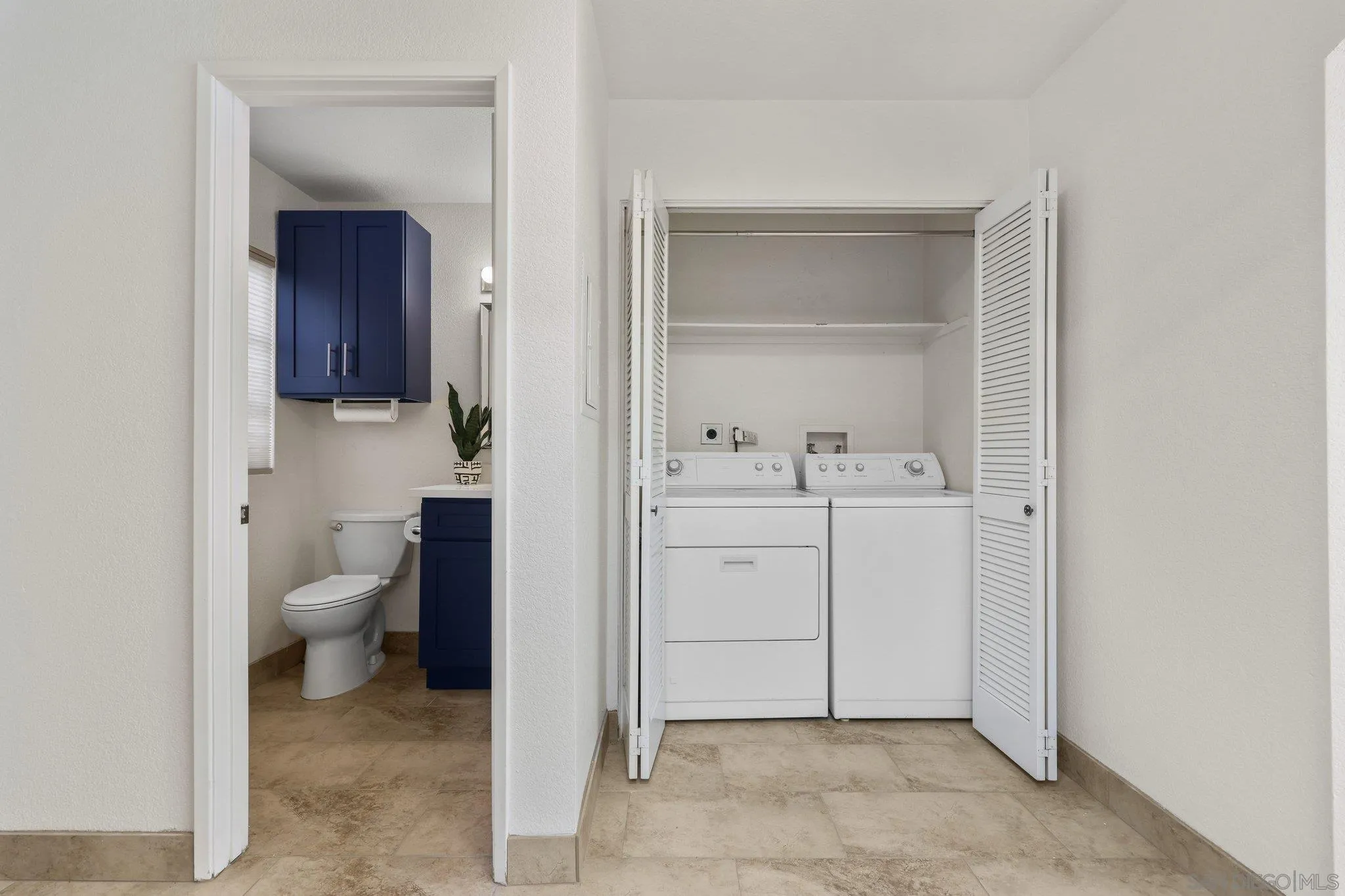 740 Breeze Hill Road, Unit 193 Vista, CA 92081 - Photo 7 of 35 a bathroom with a toilet sink and mirror