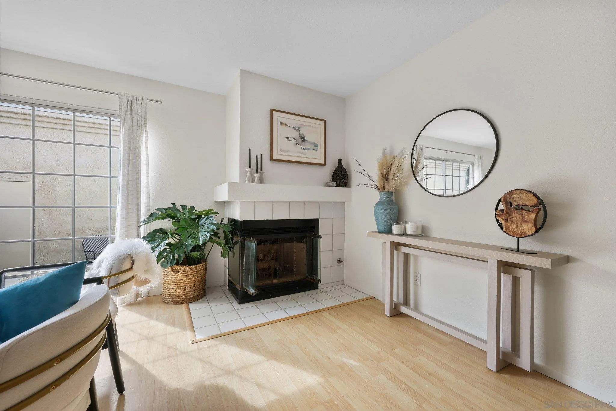 740 Breeze Hill Road, Unit 193 Vista, CA 92081 - Photo 9 of 35 a living room with furniture a clock and a window