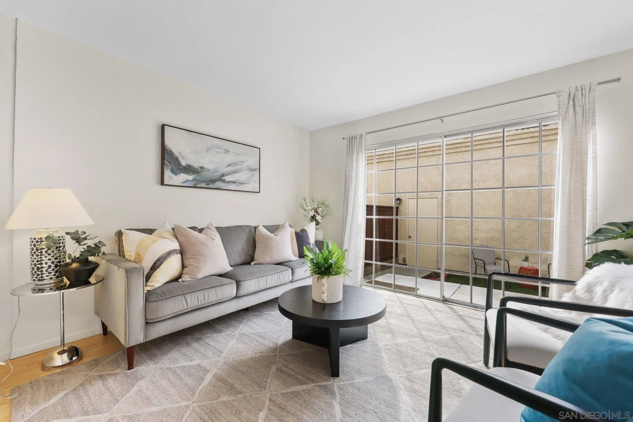 740 Breeze Hill Road, Unit 193 Vista, CA 92081 - Photo 10 of 35 a living room with furniture potted plant and a window