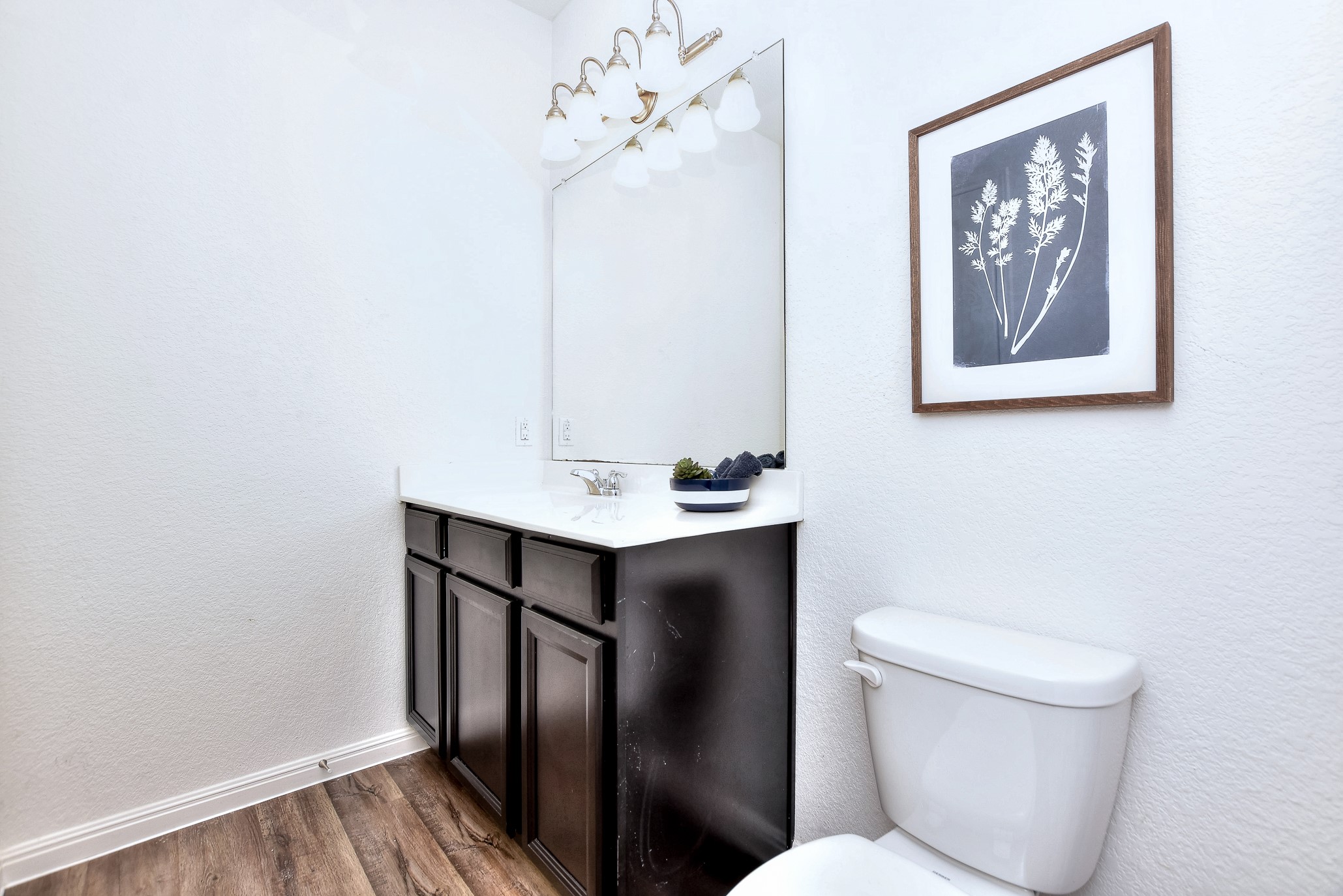 109 Helios Drive Jarrell, TX 76537 - Photo 20 of 32 a bathroom with a toilet sink and mirror
