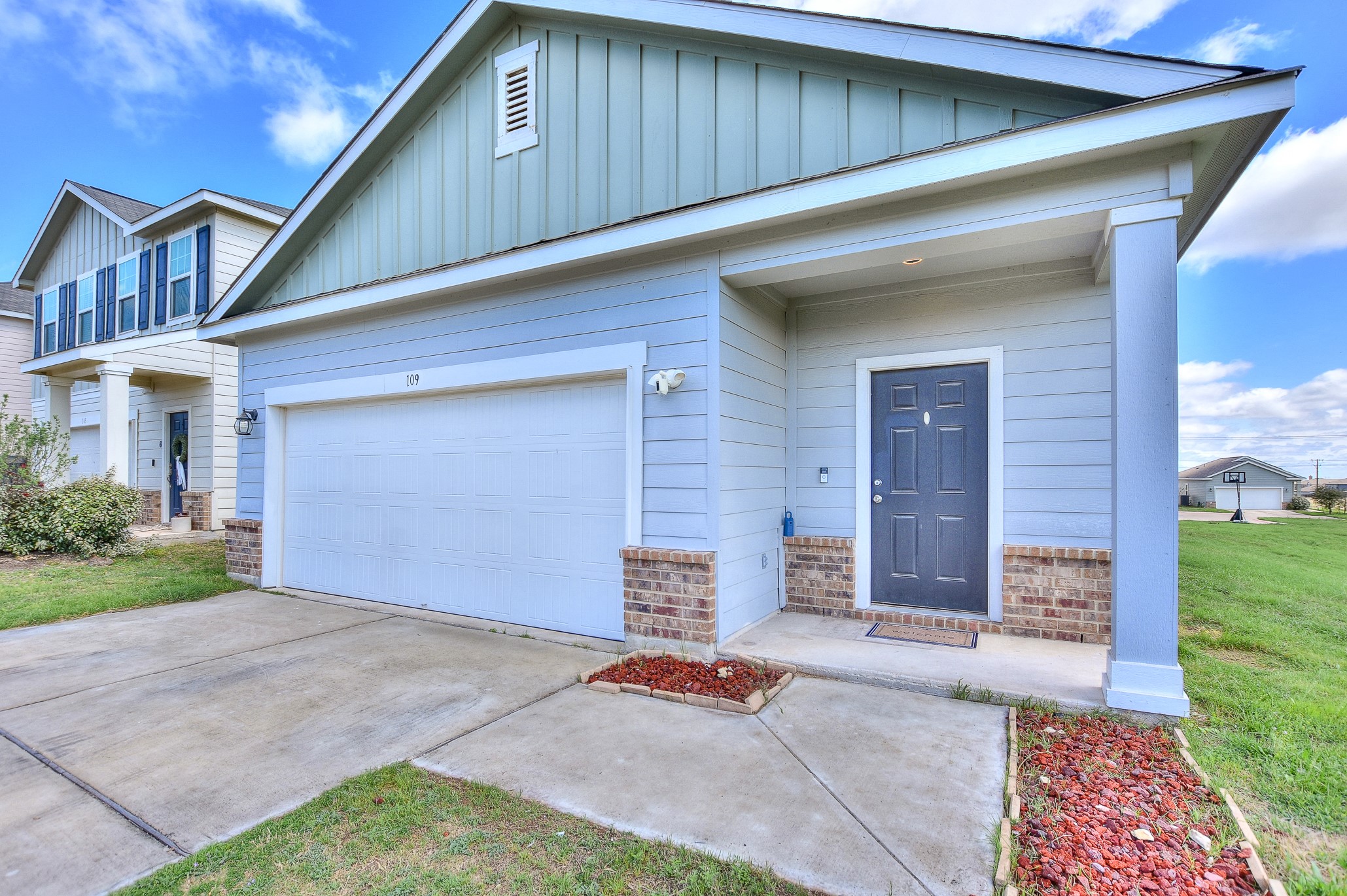 109 Helios Drive Jarrell, TX 76537 - Photo 2 of 32 a front view of a house with a yard