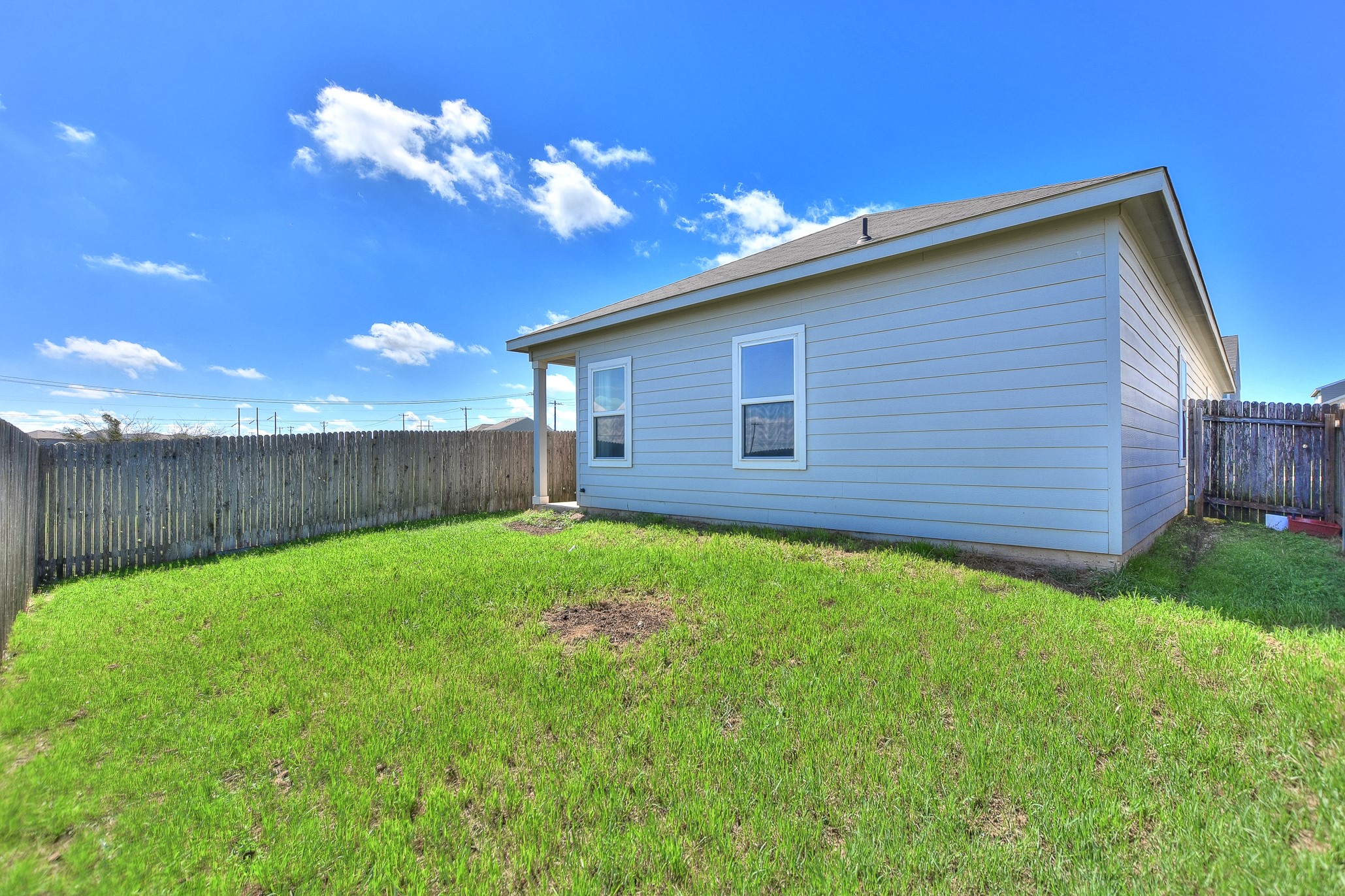 109 Helios Drive Jarrell, TX 76537 - Photo 25 of 32 a view of a house with a backyard