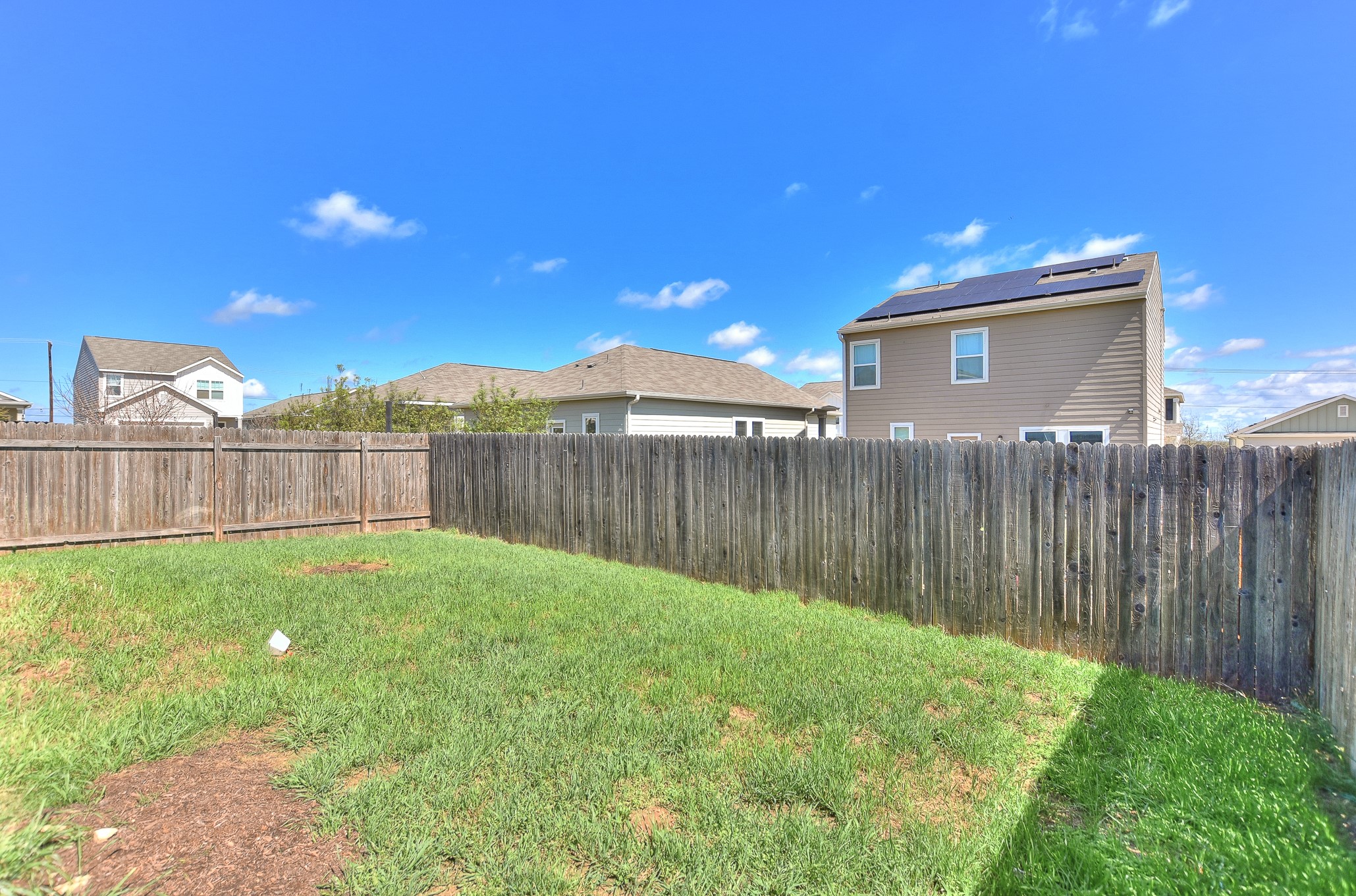 109 Helios Drive Jarrell, TX 76537 - Photo 27 of 32 a view of a backyard with wooden fence