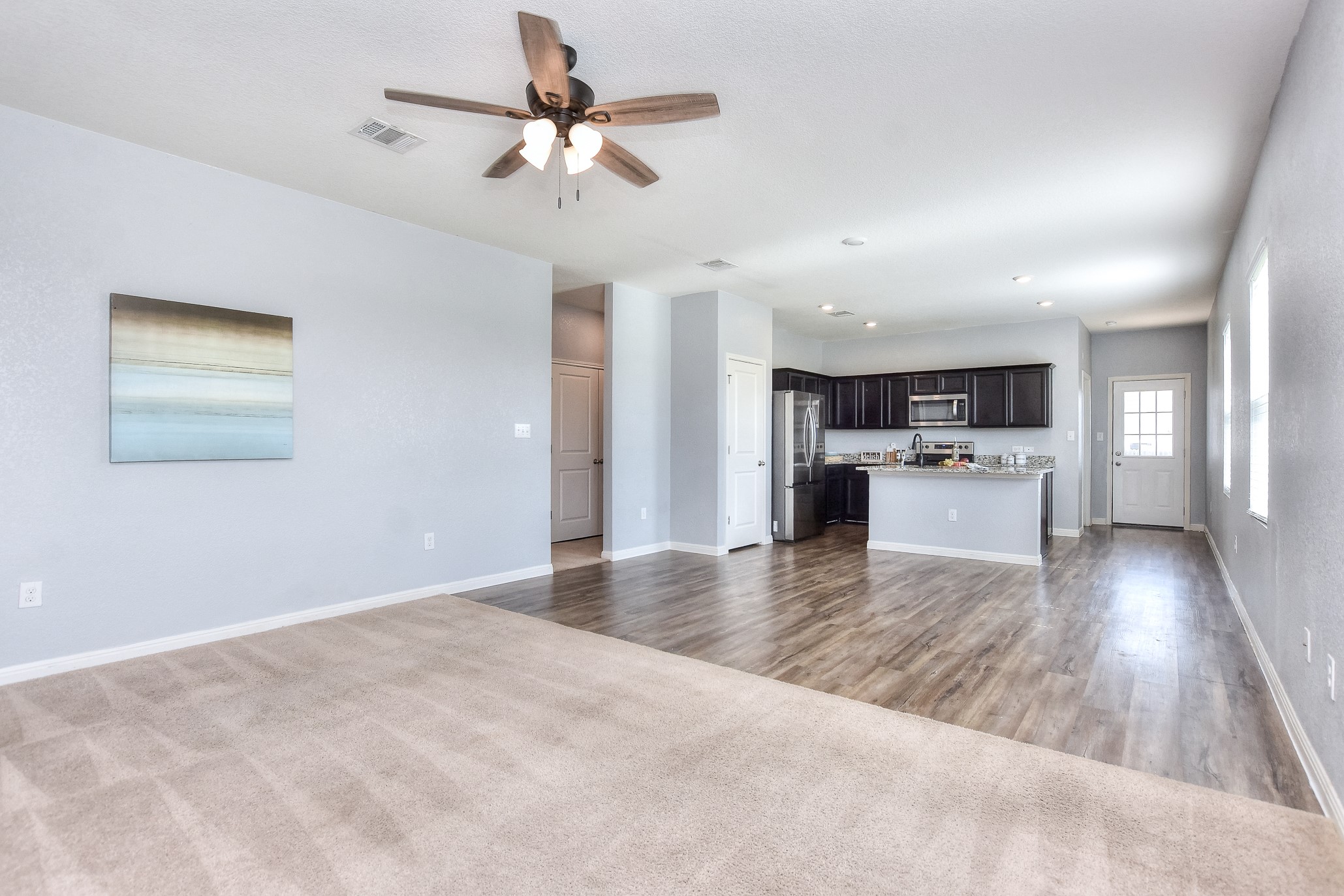 109 Helios Drive Jarrell, TX 76537 - Photo 6 of 32 a view of kitchen with sink microwave and stove