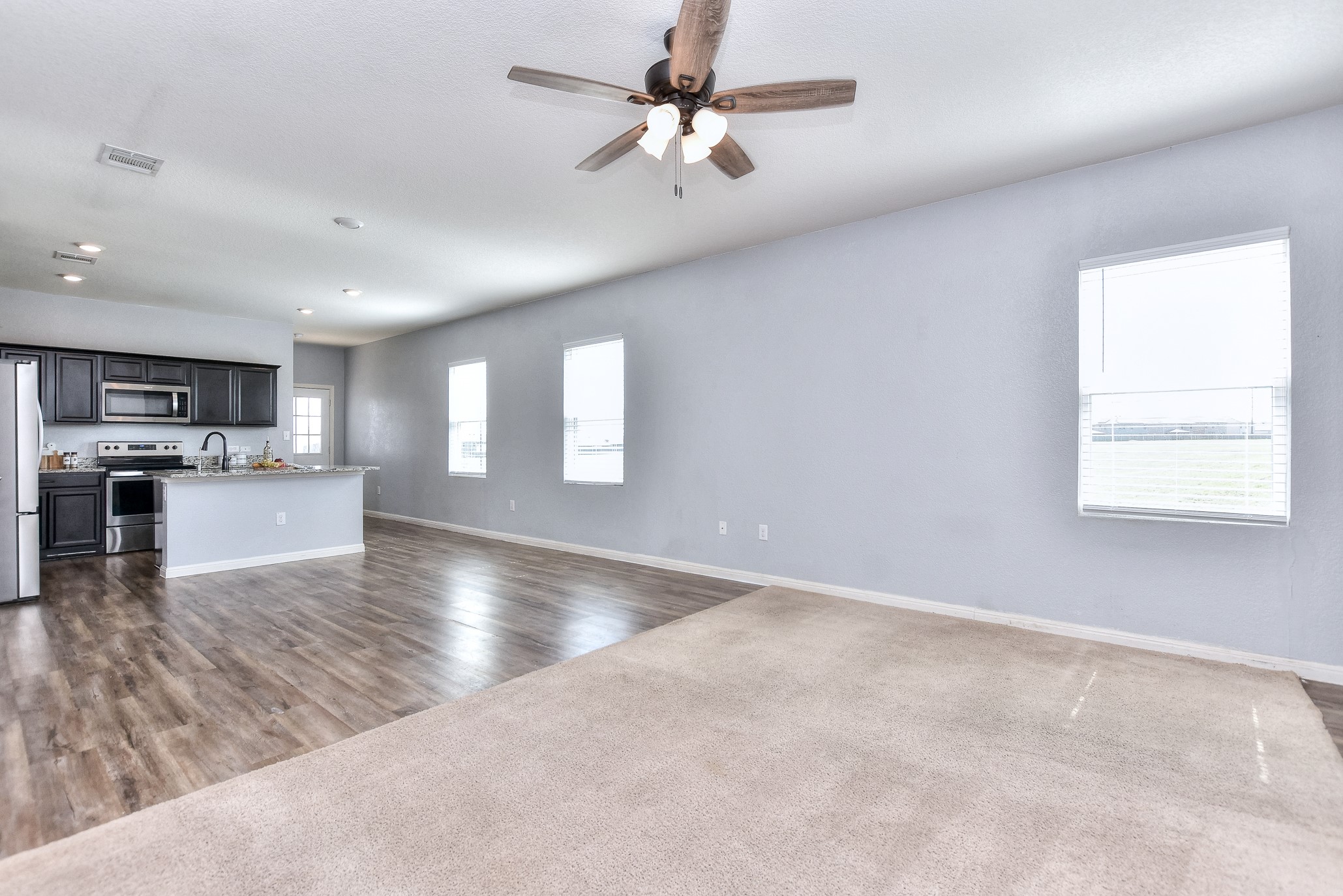 109 Helios Drive Jarrell, TX 76537 - Photo 7 of 32 a view of kitchen with stove and cabinets