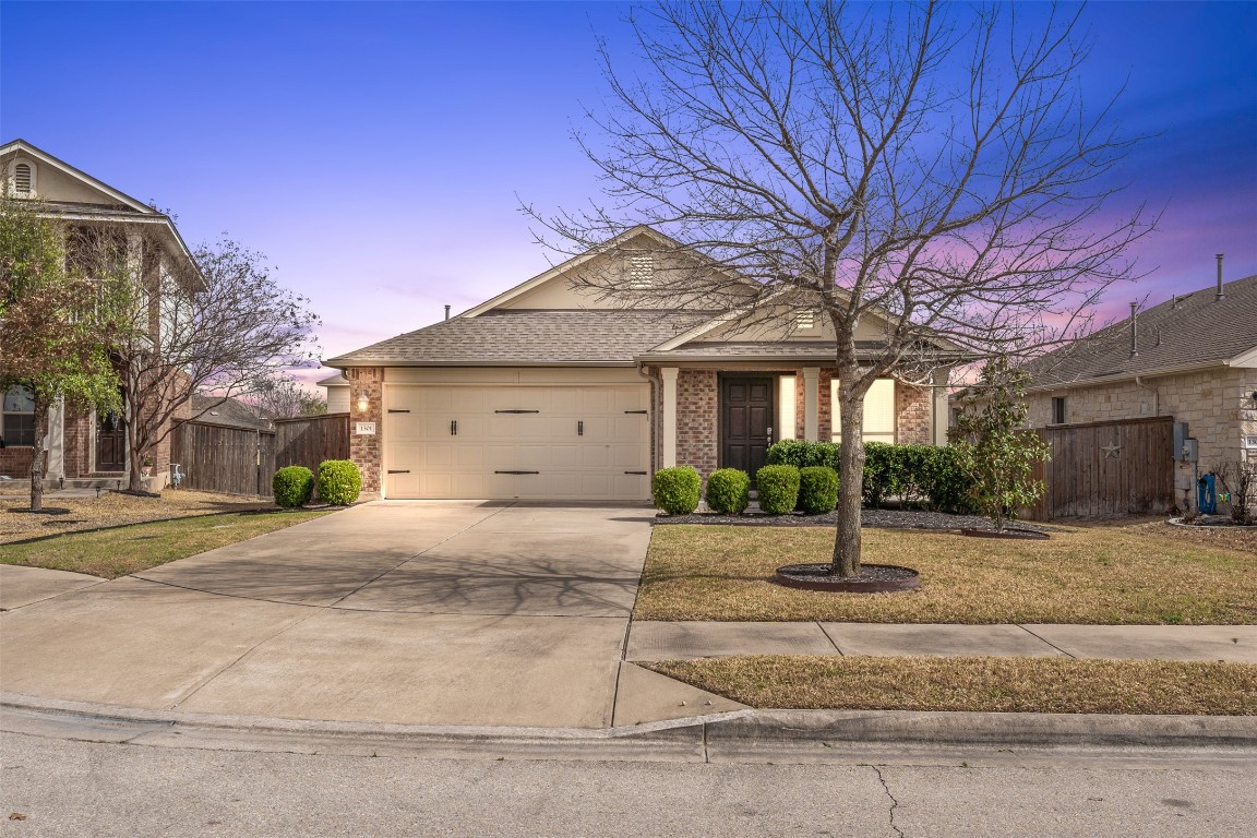 1301 April Meadows Loop Georgetown, TX 78626 - Photo 1 of 1 a front view of a house with a yard and garage