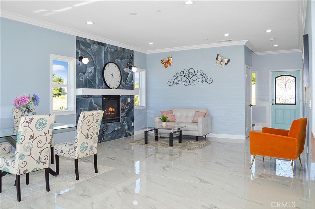 29329 Kemper Lane Highland, CA 92346 - Photo 11 of 75 a living room with furniture and a wall painting