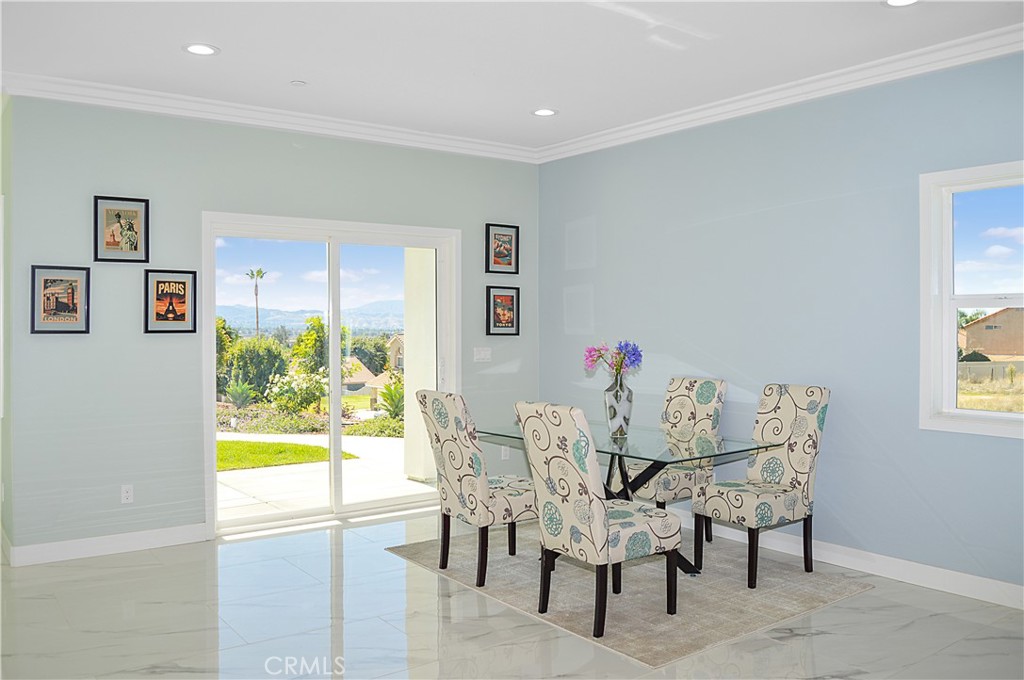 29329 Kemper Lane Highland, CA 92346 - Photo 15 of 75 a view of a dining room with furniture a rug and a window