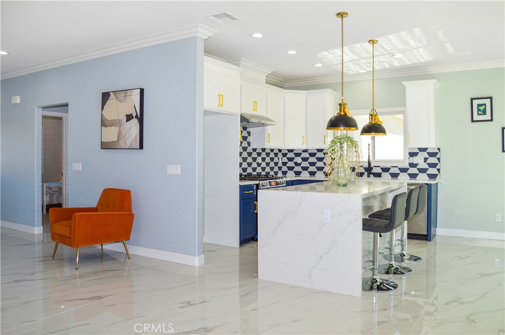 29329 Kemper Lane Highland, CA 92346 - Photo 17 of 75 a dining room filled a chandelier and kitchen view