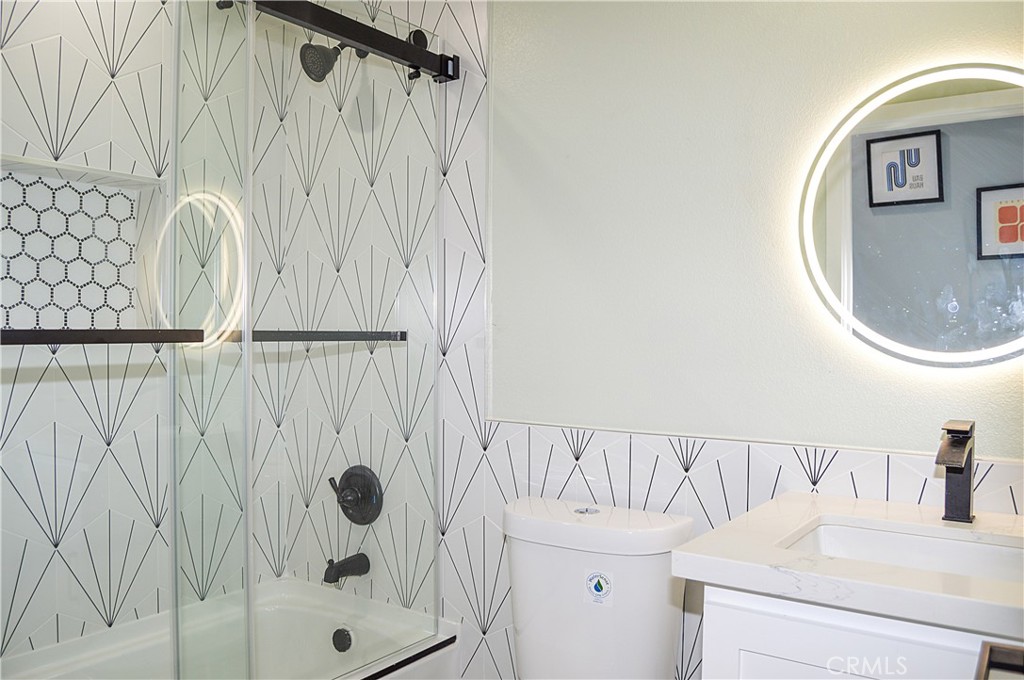 29329 Kemper Lane Highland, CA 92346 - Photo 26 of 75 a bathroom with a sink vanity and mirror