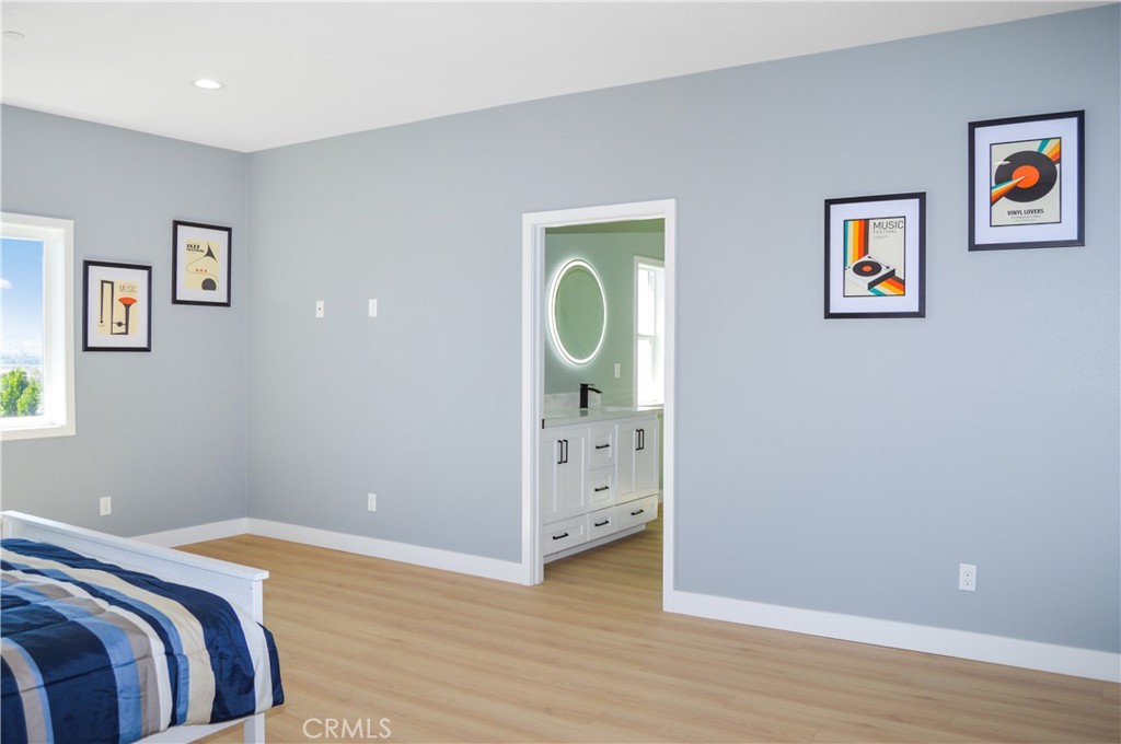 29329 Kemper Lane Highland, CA 92346 - Photo 35 of 75 a bedroom with a bed and painting on the wall