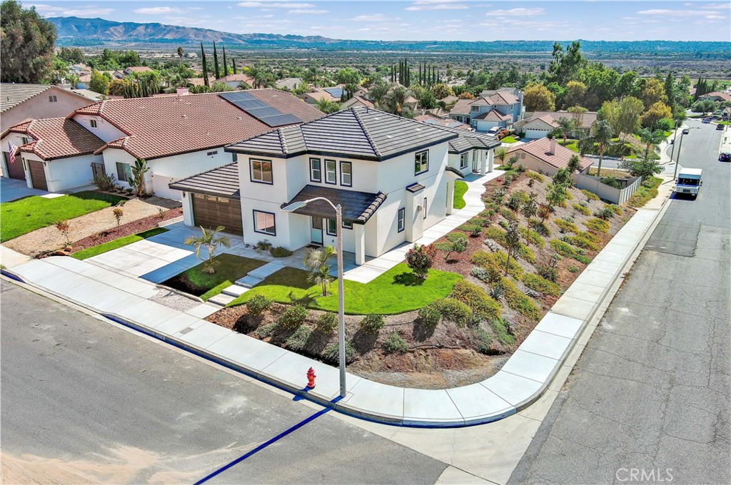 29329 Kemper Lane Highland, CA 92346 - Photo 4 of 75 an aerial view of a house with a garden and lake view