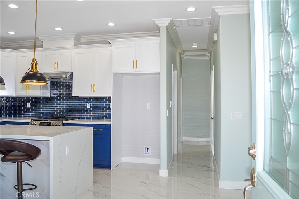 29329 Kemper Lane Highland, CA 92346 - Photo 54 of 75 a kitchen with stainless steel appliances granite countertop a refrigerator and a sink
