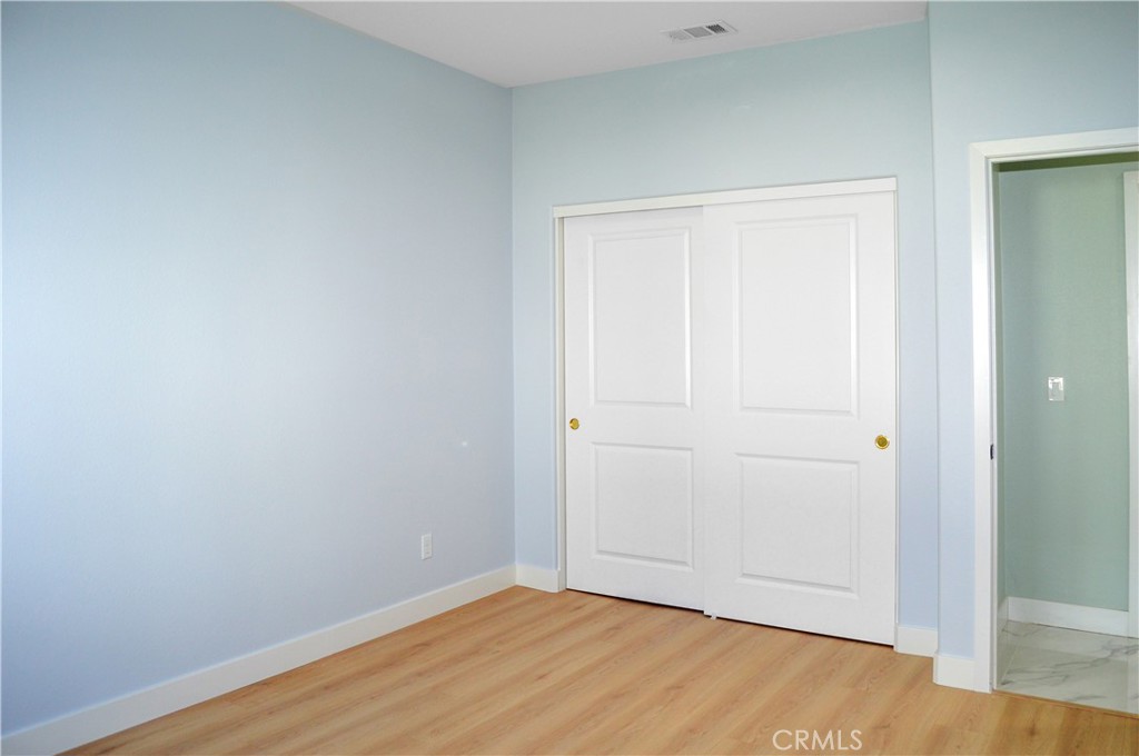 29329 Kemper Lane Highland, CA 92346 - Photo 69 of 75 an empty room with wooden floor