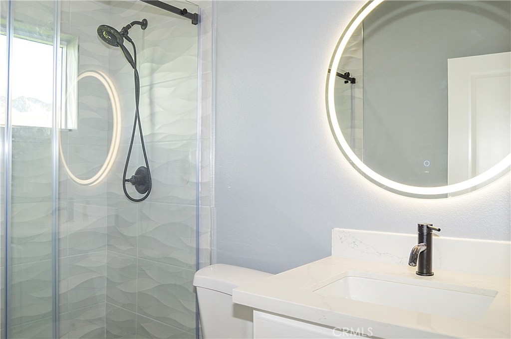 29329 Kemper Lane Highland, CA 92346 - Photo 72 of 75 a bathroom with a sink and a mirror