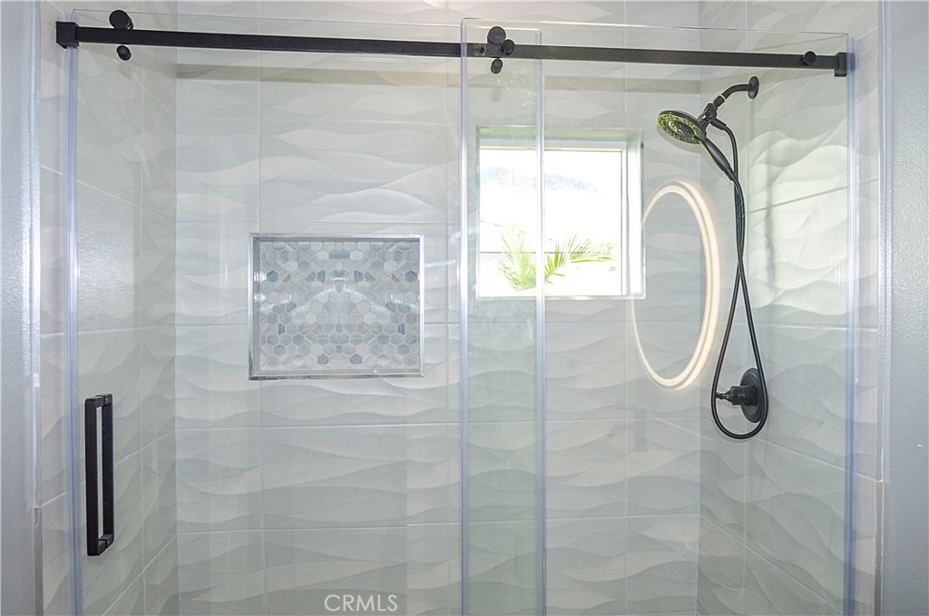 29329 Kemper Lane Highland, CA 92346 - Photo 73 of 75 Unit 2 - 2nd Bath with glass-enclosed shower and lighted mirror