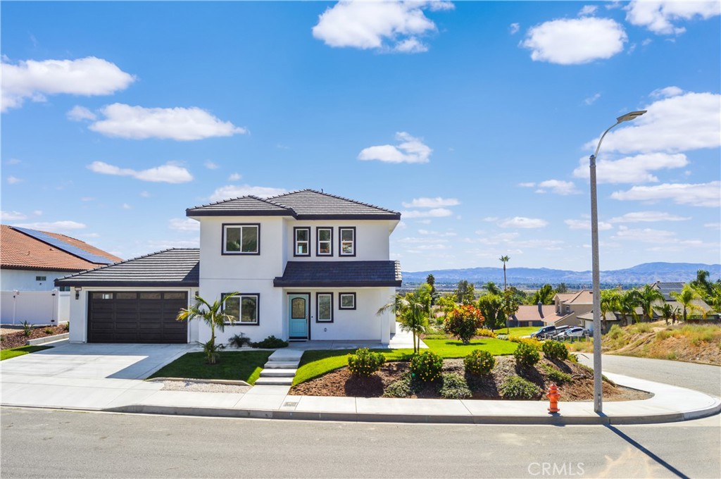 29329 Kemper Lane Highland, CA 92346 - Photo 9 of 75 a front view of small house with yard swimming pool and outdoor seating