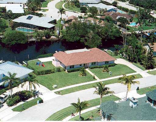 706 Irwin Lane Jupiter, FL 33458 - Photo 1 of 16 an aerial view of a house