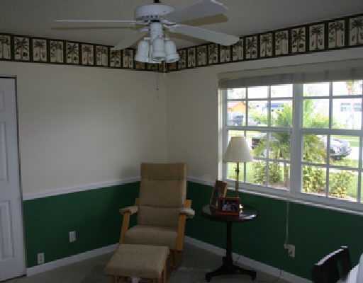 706 Irwin Lane Jupiter, FL 33458 - Photo 15 of 16 a living room with furniture and a window