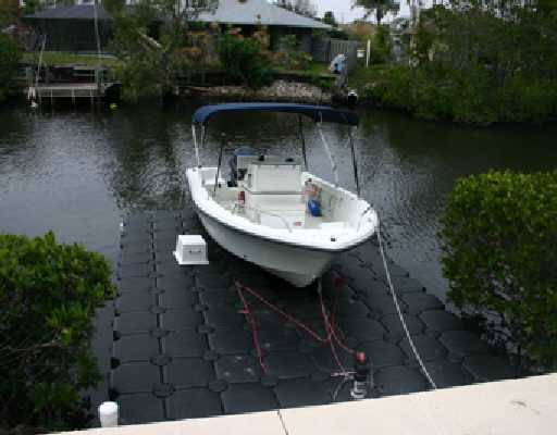 706 Irwin Lane Jupiter, FL 33458 - Photo 4 of 16 a backyard of a house with lots of green space and lake view