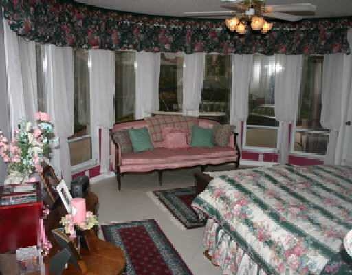 706 Irwin Lane Jupiter, FL 33458 - Photo 8 of 16 a living room with furniture and a potted plant
