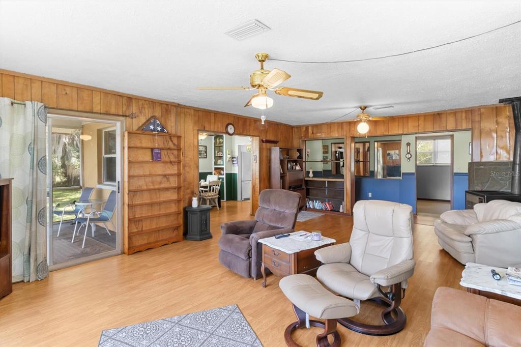 1226 South Telephone Point Road Inverness, FL 34450 - Photo 22 of 43 a living room with furniture a ceiling fan and a window
