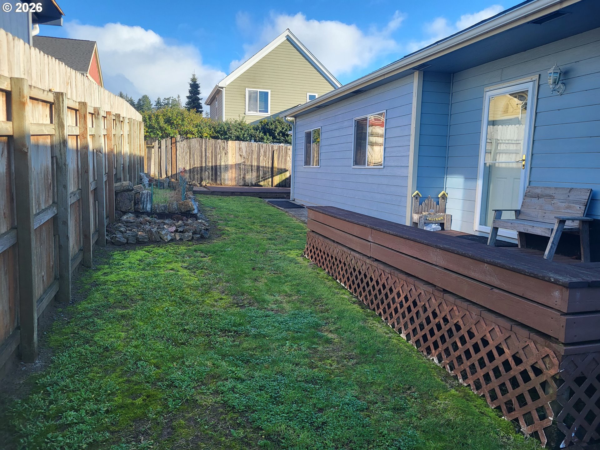 963 Crocker Street Coos Bay, OR 97420 - Photo 2 of 42 a front view of a house with a yard