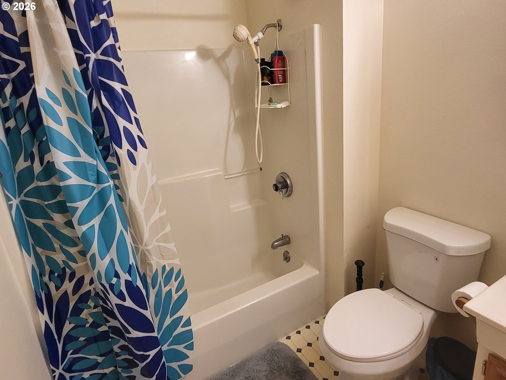 963 Crocker Street Coos Bay, OR 97420 - Photo 28 of 42 a white toilet sitting next to a bath tub and shower