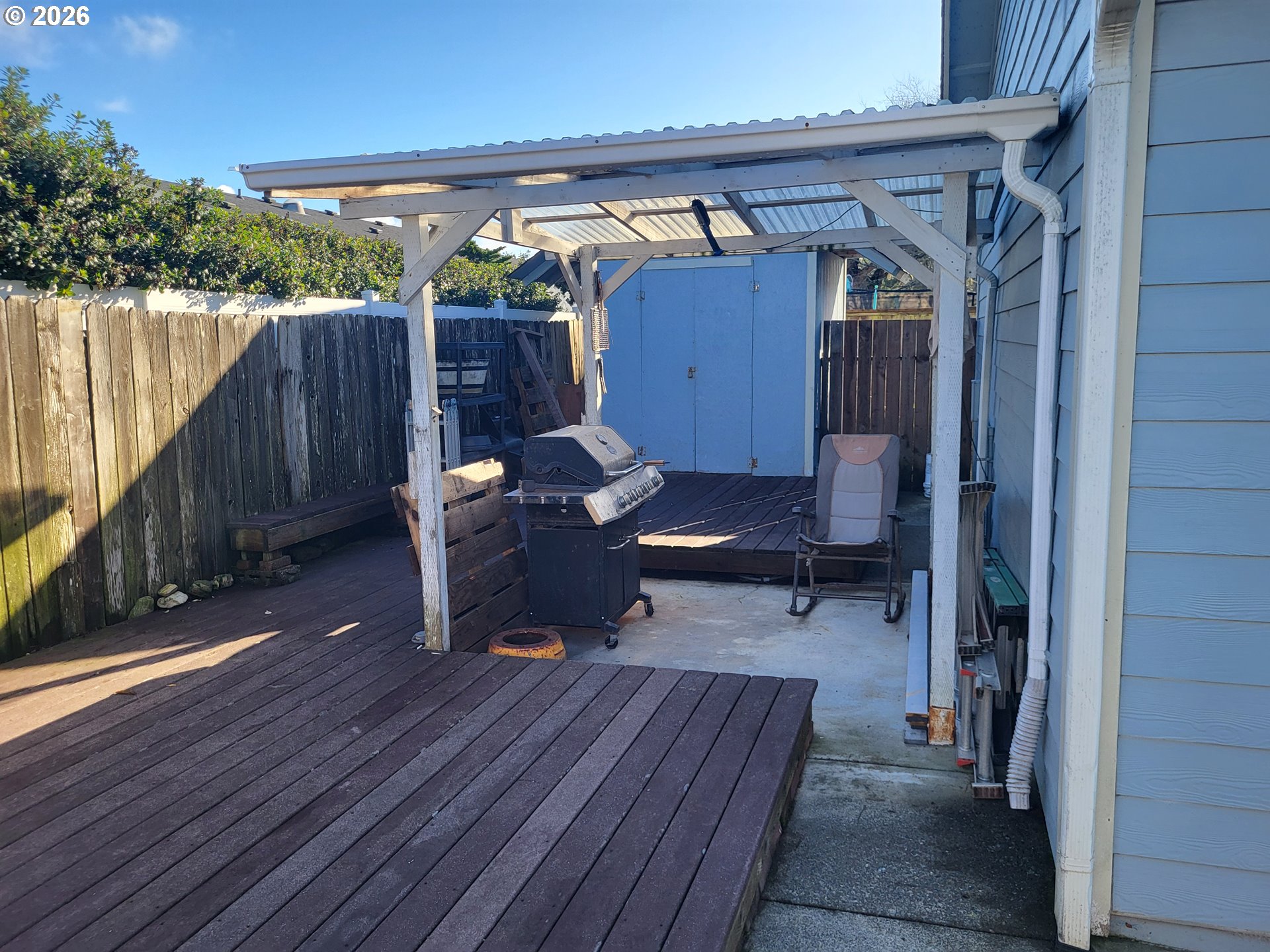 963 Crocker Street Coos Bay, OR 97420 - Photo 38 of 42 a view of a deck with wooden floor and outdoor seating