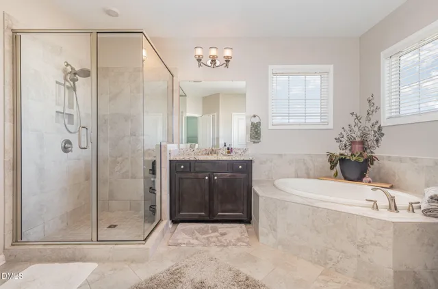 a view of a house with a big yard plants and large trees