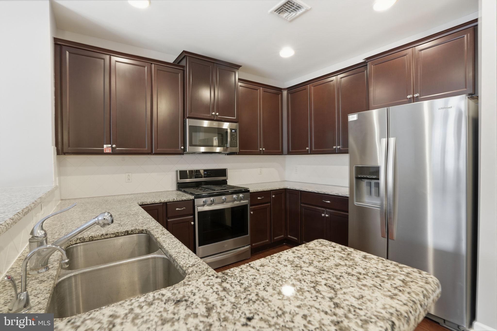 235 Carson Terrace Huntingdon Valley, PA 19006 - Photo 11 of 23 a kitchen with a refrigerator sink and stainless steel appliances