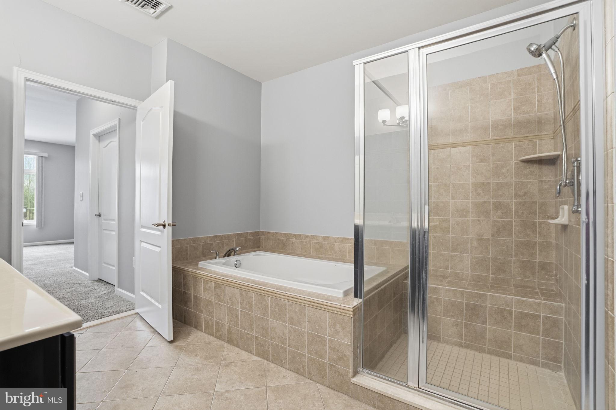 235 Carson Terrace Huntingdon Valley, PA 19006 - Photo 20 of 23 a bathroom with a tub a sink and a shower