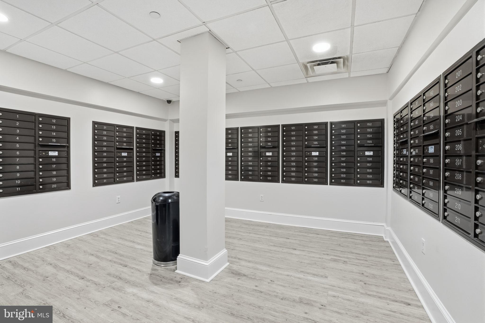 235 Carson Terrace Huntingdon Valley, PA 19006 - Photo 3 of 23 a view of an empty room with wooden floor and a window