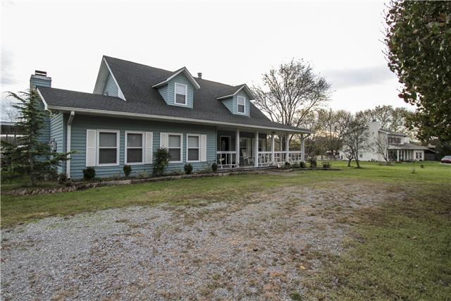 1230 Northwest Rutland Road Mount Juliet, TN 37122 - Photo 2 of 20 Bring the rocking chairs to enjoy the wrap around porch on front, side and rear of home.