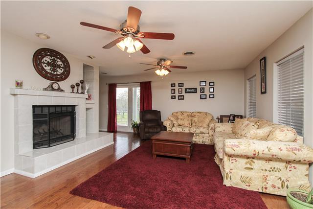1230 Northwest Rutland Road Mount Juliet, TN 37122 - Photo 4 of 20 Living area with hardwood floors and a fireplace.
