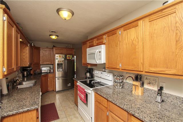 1230 Northwest Rutland Road Mount Juliet, TN 37122 - Photo 6 of 20 The kitchen features lots of cabinet space with granite counter tops.