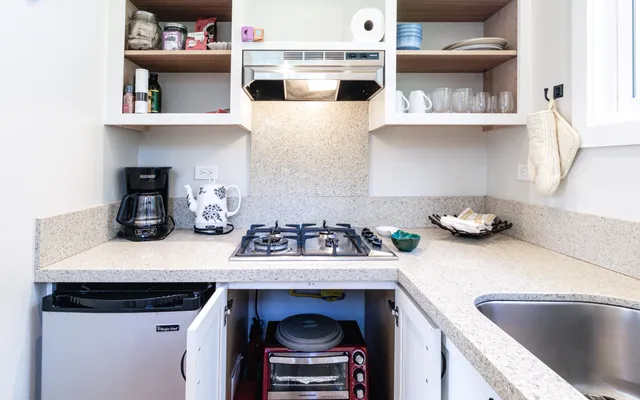 a kitchen with a stove and a refrigerator