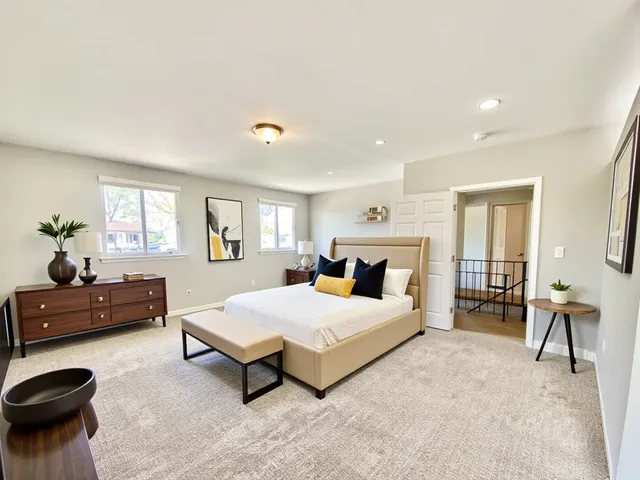 a bedroom with a bed and furniture