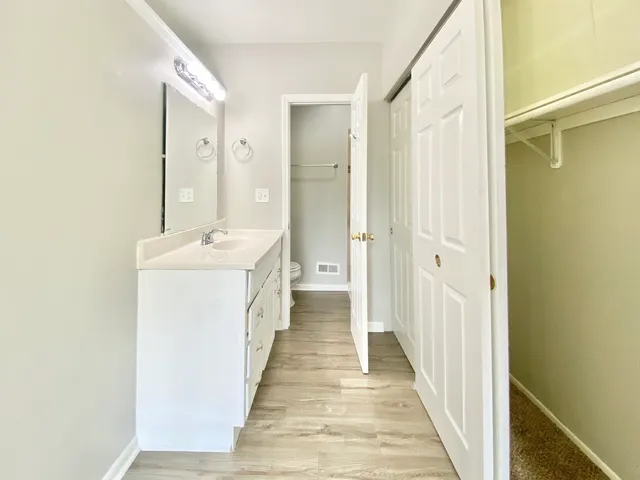 a hallway with white doors