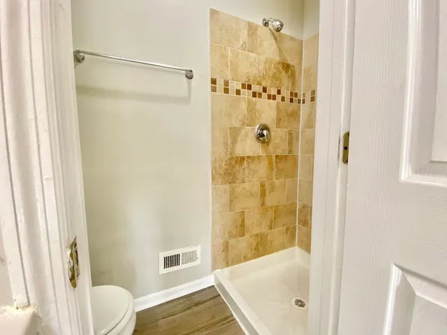 a bathroom with a tub and shower