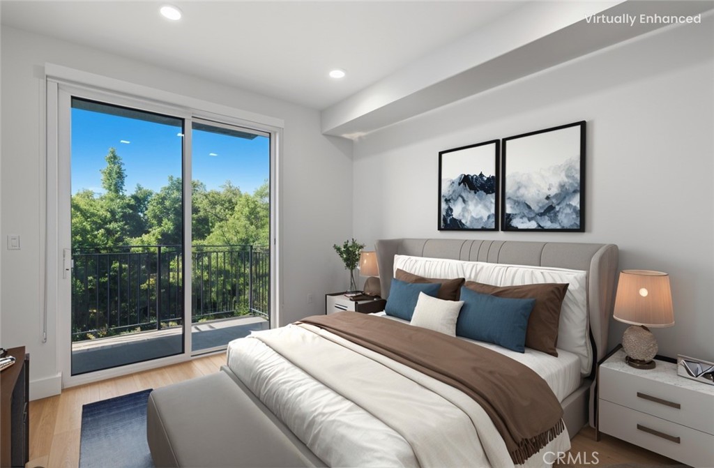 12078 Guerin Street, Unit 405 Studio City, CA 91604 - Photo 11 of 21 a bedroom with a large bed and a window