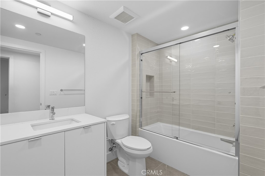 12078 Guerin Street, Unit 405 Studio City, CA 91604 - Photo 14 of 21 a bathroom with a sink toilet and shower