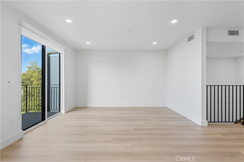 12078 Guerin Street, Unit 405 Studio City, CA 91604 - Photo 10 of 21 a view of an empty room with wooden floor