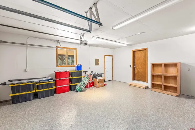 a view of a room with air conditioner duct and windows