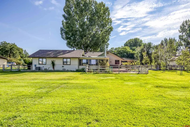 a front view of a house with swimming pool