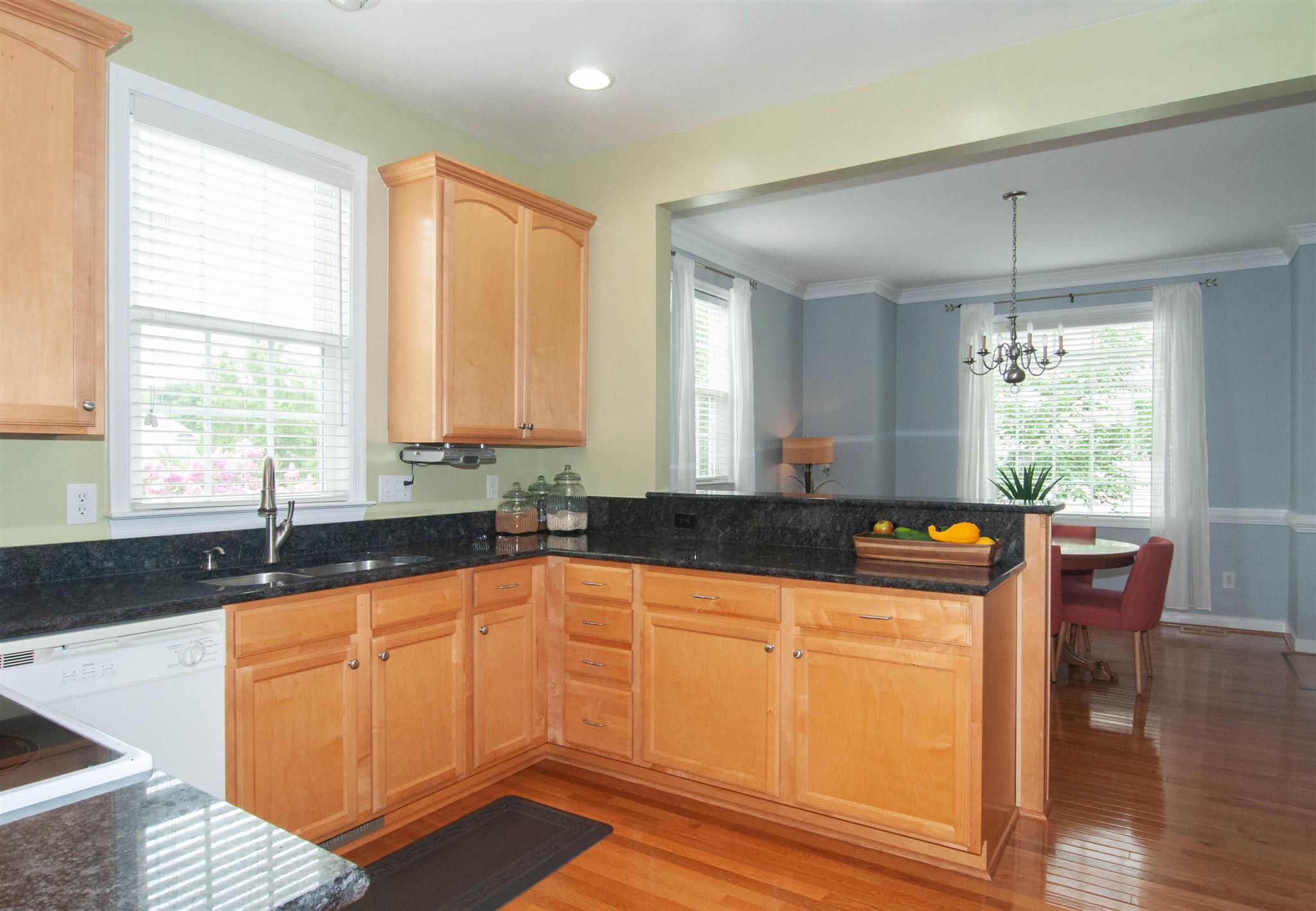 1265 Amber Ridge Road Charlottesville, VA 22901 - Photo 11 of 44 a kitchen with granite countertop a sink and cabinets